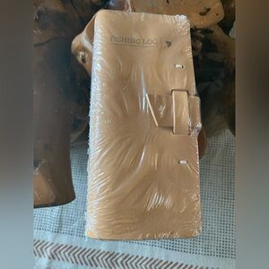 Brand new Rustico Buckskin fishing log.